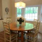 Five Foot Round Pine Breakfast Table and Chairs.