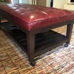 Leather Ottoman With Lower Shelf On Casters'