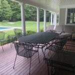 Porch And Patio Coated Wrought Iron Table And Chairs And Chaise Chairs In Beige